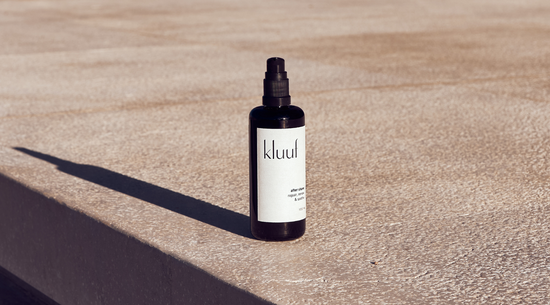 kluuf's sustainable after shave on stone ground with shadow